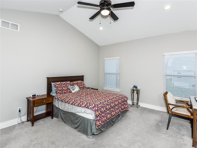 bedroom featuring visible vents, carpet floors, baseboards, and vaulted ceiling