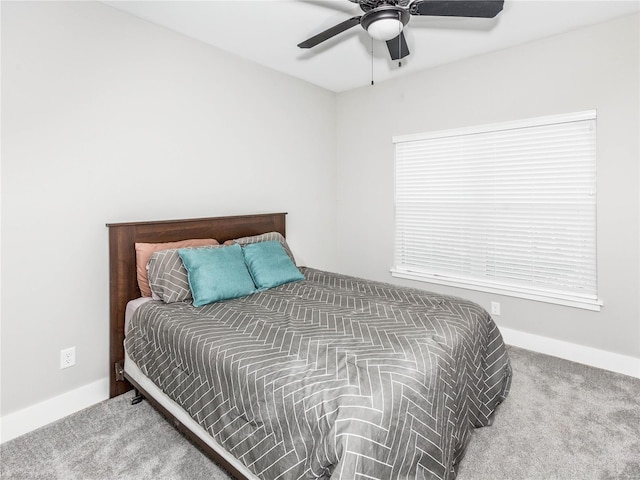 bedroom featuring carpet flooring, baseboards, and ceiling fan