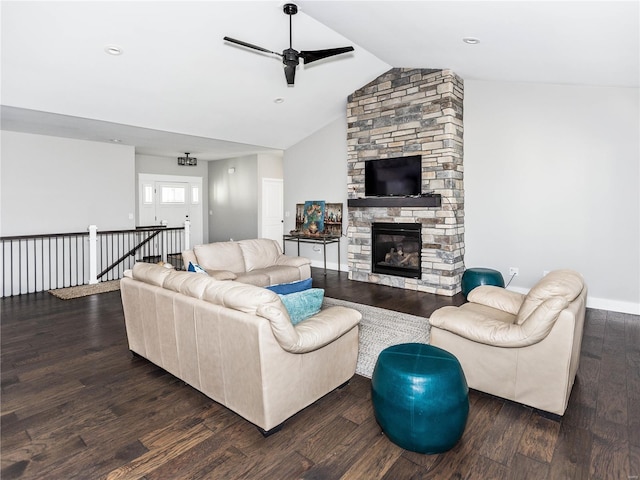 living room featuring lofted ceiling, dark wood-style floors, a fireplace, baseboards, and ceiling fan