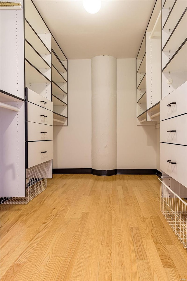 spacious closet with light wood finished floors