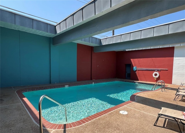 community pool with a patio