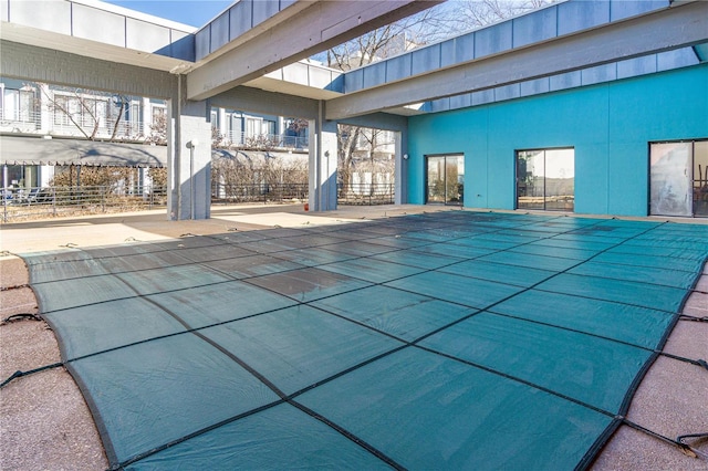 view of pool featuring a patio area and a covered pool