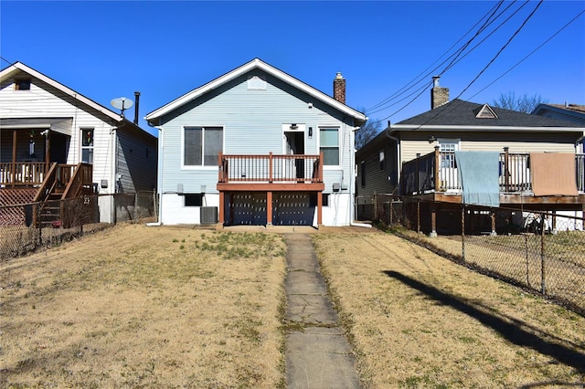 back of house featuring fence, a deck, and central air condition unit