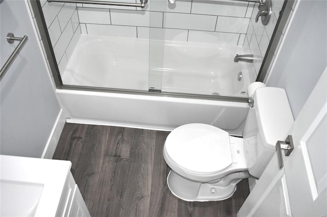 bathroom featuring shower / bath combination with glass door and toilet