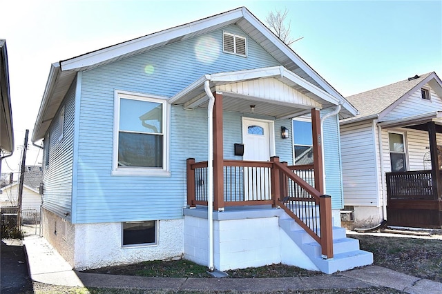 bungalow-style home featuring covered porch