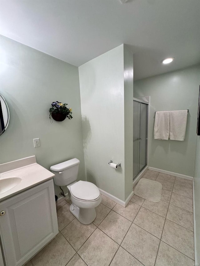 full bath with vanity, tile patterned flooring, a shower stall, and toilet