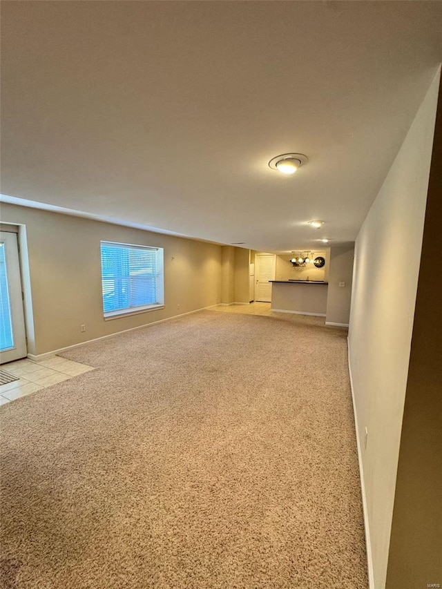 empty room with carpet floors and baseboards