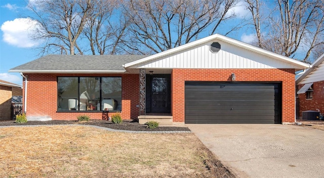 ranch-style house with an attached garage, central air condition unit, brick siding, concrete driveway, and a front lawn