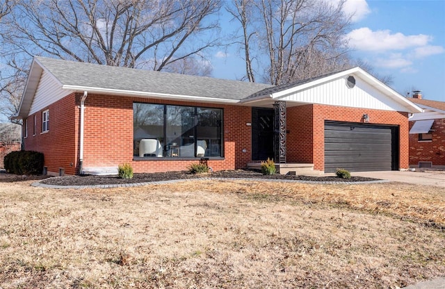 ranch-style home featuring an attached garage, a shingled roof, concrete driveway, and brick siding