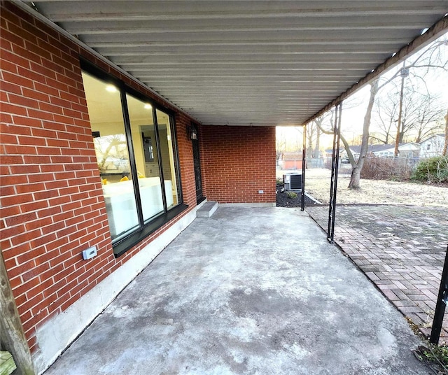 view of patio featuring an attached carport and cooling unit