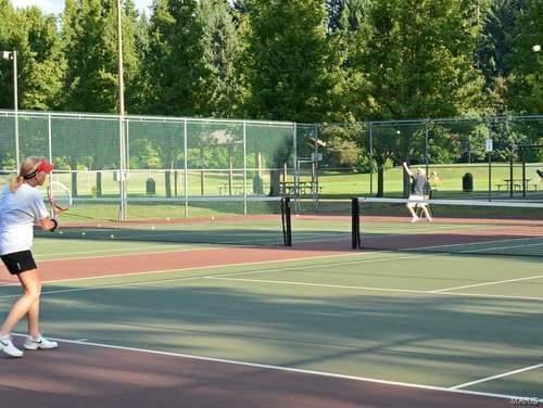 view of sport court with fence