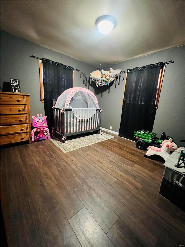 bedroom featuring wood finished floors