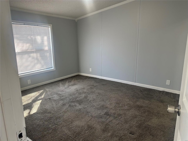 unfurnished room featuring a textured ceiling, carpet floors, ornamental molding, and baseboards