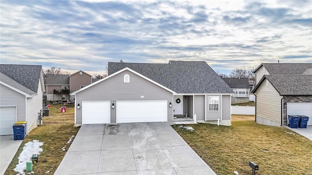 view of front of property with concrete driveway, a front lawn, roof with shingles, and an attached garage