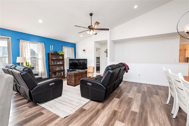 living area with lofted ceiling, wood finished floors, a ceiling fan, and recessed lighting