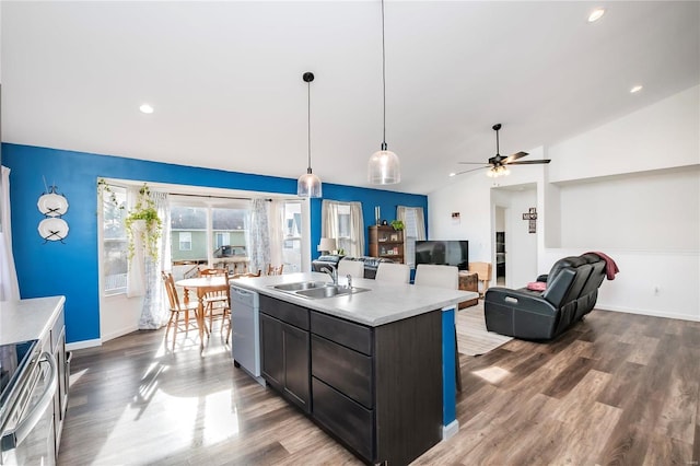 kitchen with lofted ceiling, light countertops, a sink, dishwasher, and stainless steel electric range