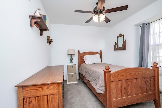 bedroom featuring a ceiling fan and carpet