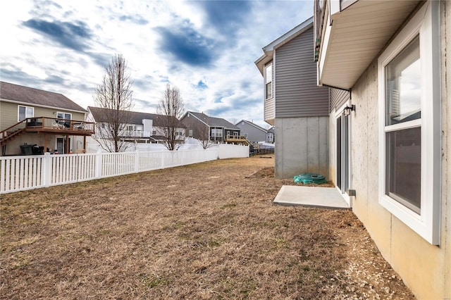 view of yard with a residential view and fence