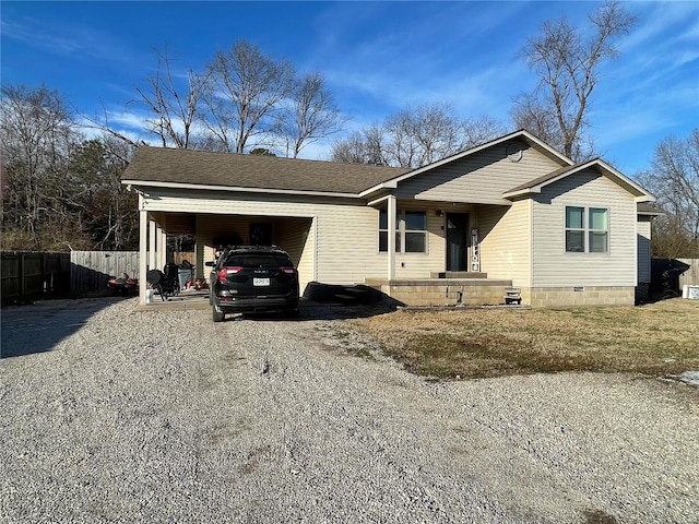 view of front of house featuring gravel driveway, crawl space, a shingled roof, and fence