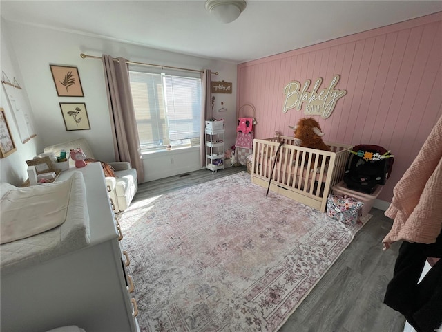 bedroom featuring wood finished floors