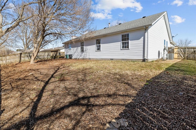 back of house with fence