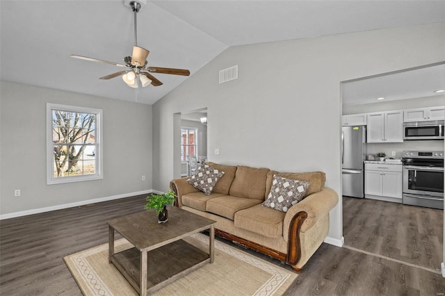 living room featuring baseboards, vaulted ceiling, visible vents, and dark wood finished floors