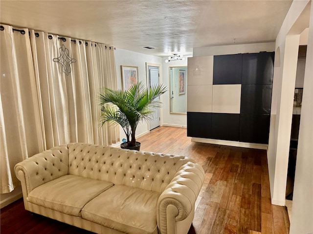 interior space with hardwood / wood-style floors and baseboards