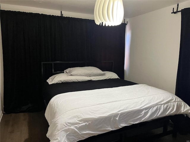 bedroom featuring wood finished floors