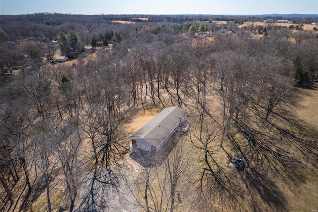 birds eye view of property with a wooded view