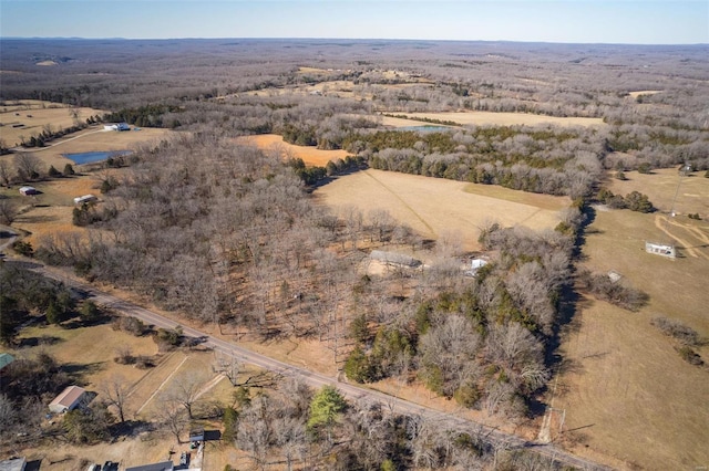 birds eye view of property with a rural view