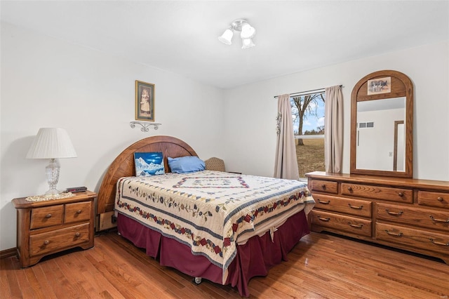 bedroom featuring light wood-style flooring