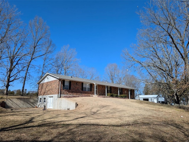 ranch-style house featuring a garage and brick siding