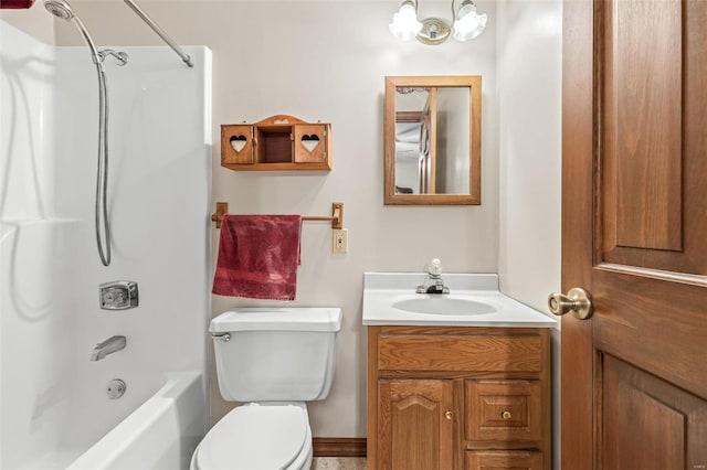 bathroom featuring toilet, washtub / shower combination, and vanity