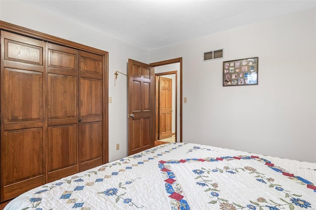 bedroom featuring a closet and visible vents