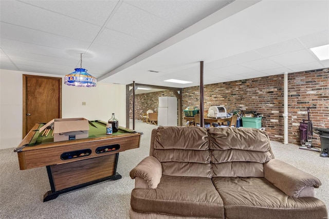 game room featuring brick wall, carpet, billiards, and a wood stove