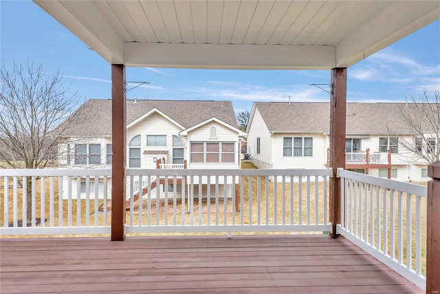 wooden terrace featuring a residential view