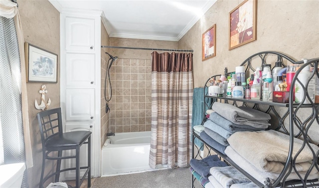 full bathroom with shower / tub combo with curtain, a textured wall, and ornamental molding