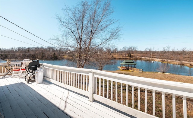 wooden deck featuring a water view