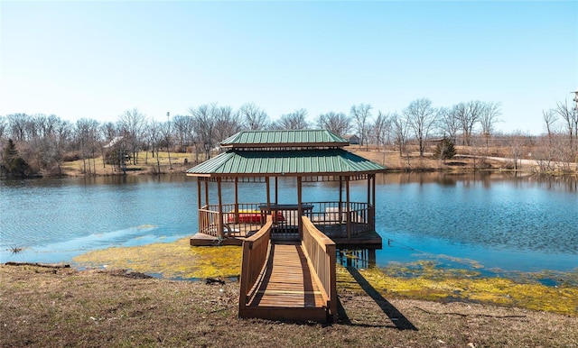 view of dock featuring a gazebo and a water view