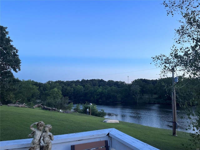 view of water feature with a view of trees