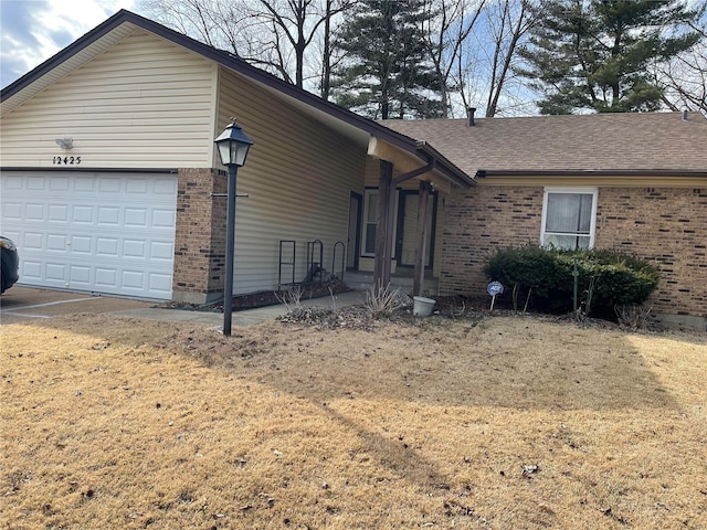 single story home featuring a garage, brick siding, and roof with shingles