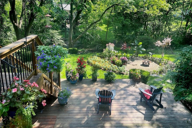 wooden terrace with a fire pit