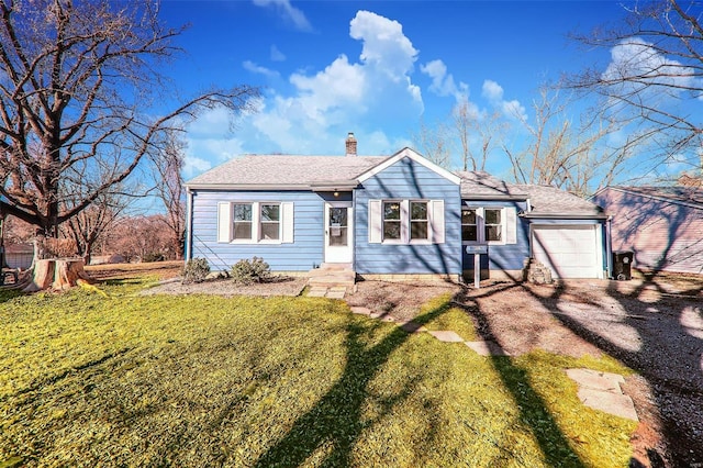 view of front facade featuring an attached garage, a shingled roof, dirt driveway, a chimney, and a front yard