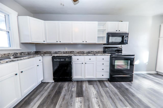 kitchen featuring wood finished floors, white cabinetry, black appliances, and open shelves