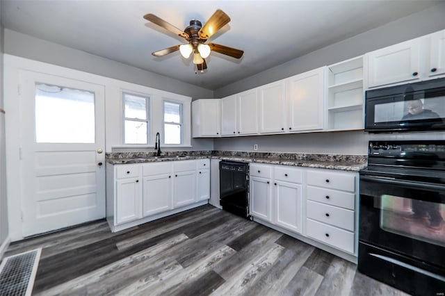 kitchen with black appliances, white cabinetry, open shelves, and a sink