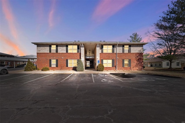 view of property featuring uncovered parking