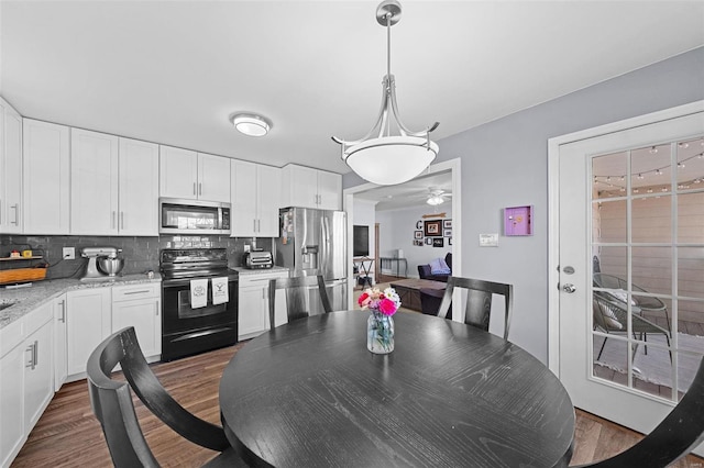 dining space featuring dark wood finished floors