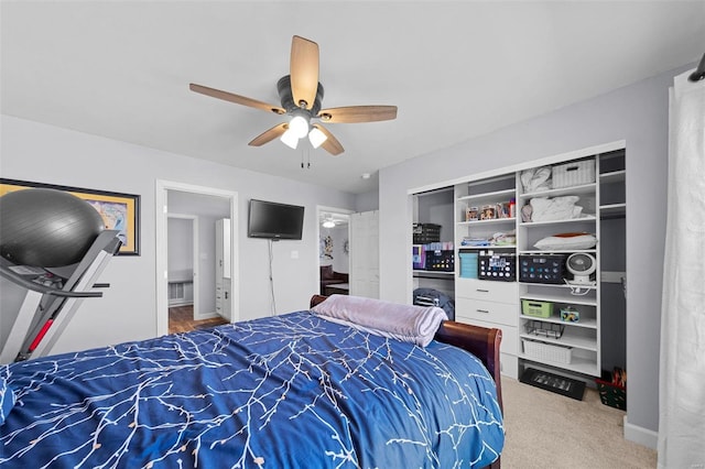 carpeted bedroom featuring ceiling fan and baseboards