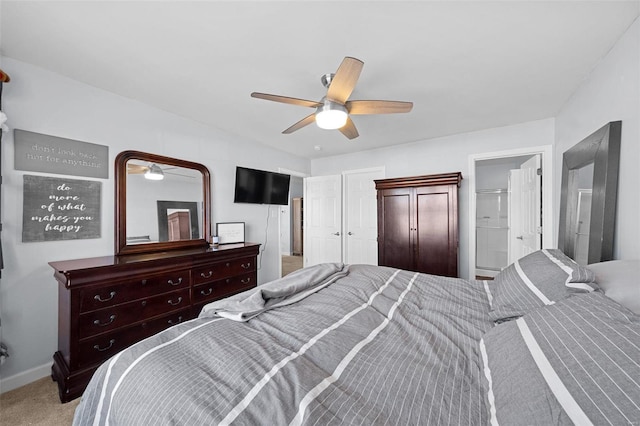 carpeted bedroom featuring baseboards and a ceiling fan