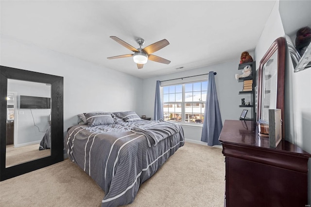 bedroom with carpet, baseboards, and a ceiling fan